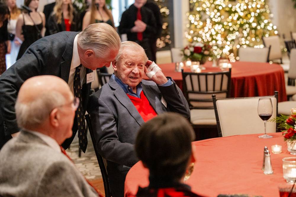 J.C. Huizinga speaking to other reception guest